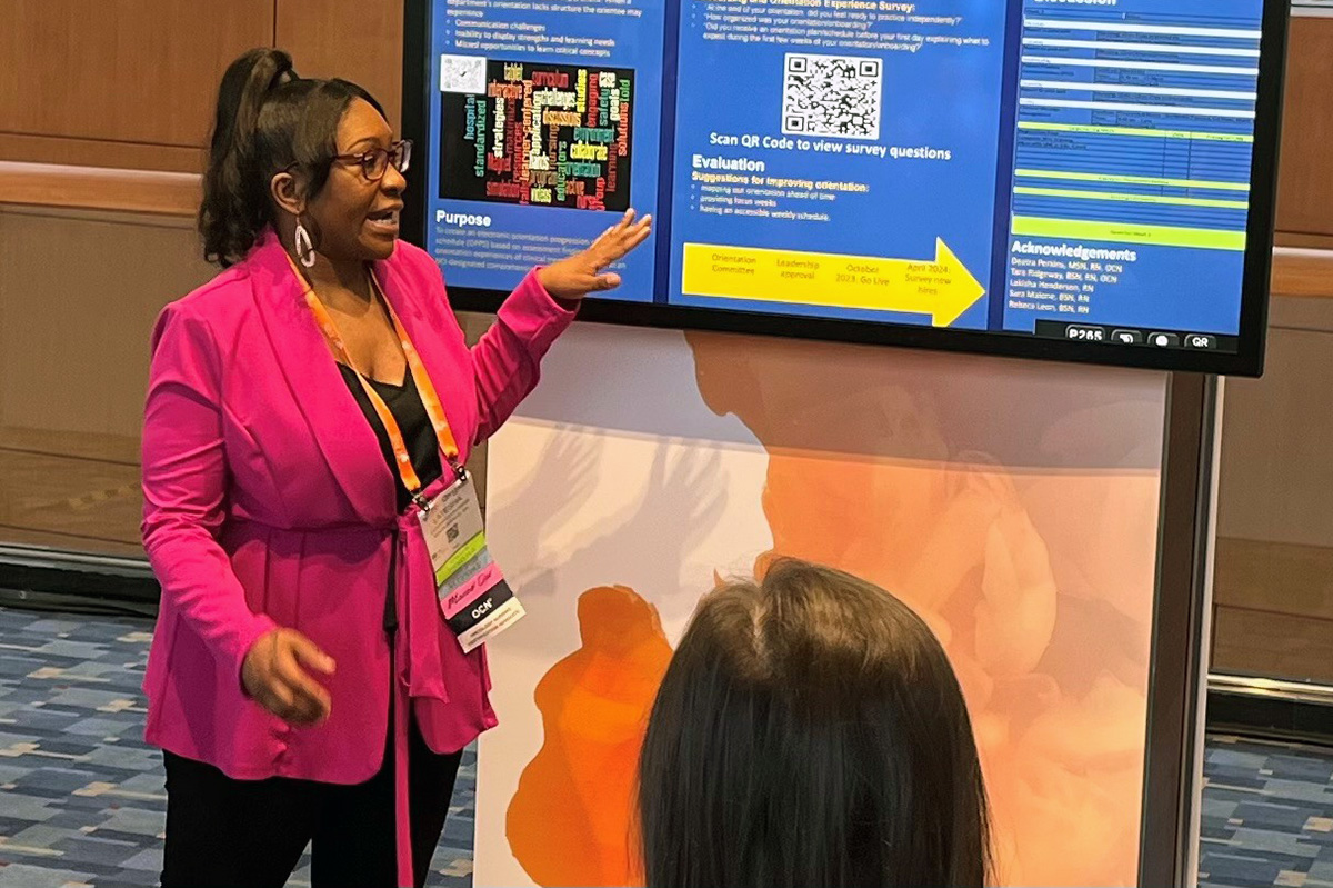 Latesha Cook-Webb, MSN, RN, OCN, presents her poster at the Oncology Nursing Society Congress.